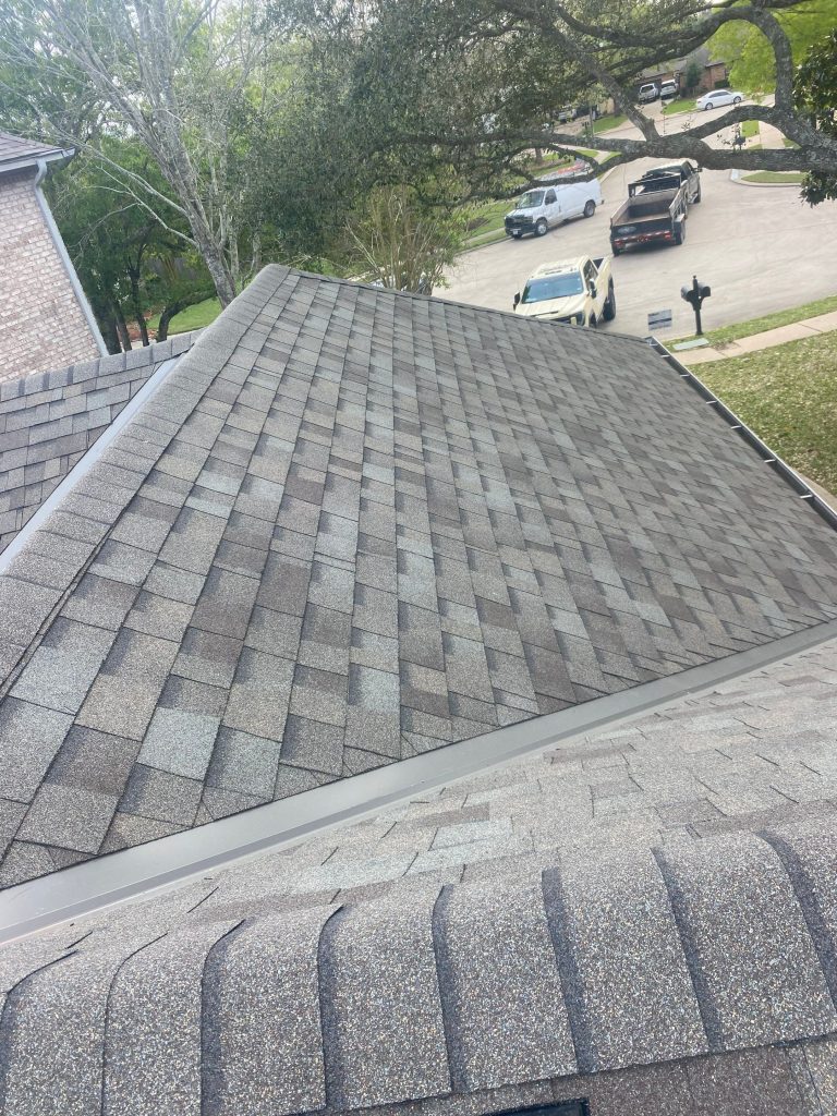 Architectural shingle roof valley and ridge on a residential home