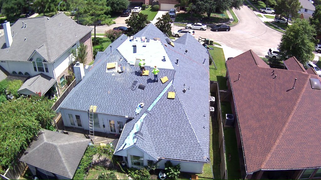 Aerial view of a residential shingle roof by Talton Roofing Solutions